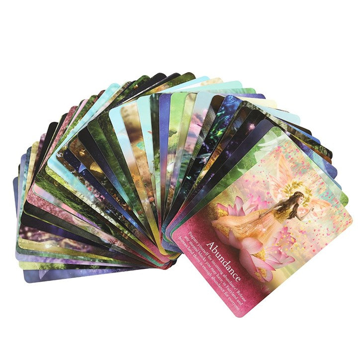 A colourful spread out oracle deck against a white background