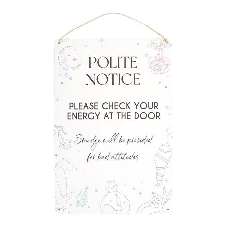 A tin sign with an illustration of crystals, potion bottles, and smudge sticks, accompanied by the phrase 'POLITE NOTICE PLEASE CHECK YOUR ENERGY AT THE DOOR. SMOUDGE WILL BE PROVIDED FOR BAD ATTITUDES. 
