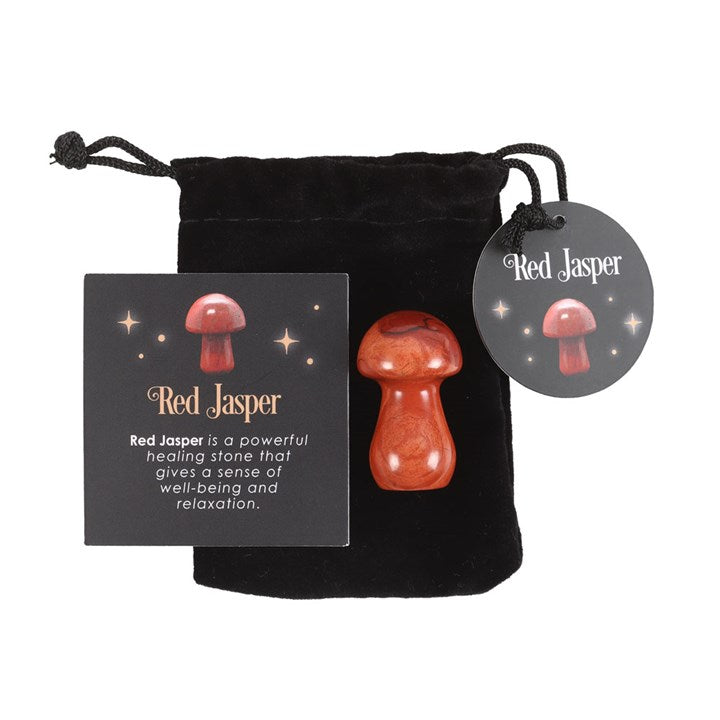 A Red Jasper mushroom crystal, with a drawstring bag and a card that has 'Red Jasper' text next to it.
