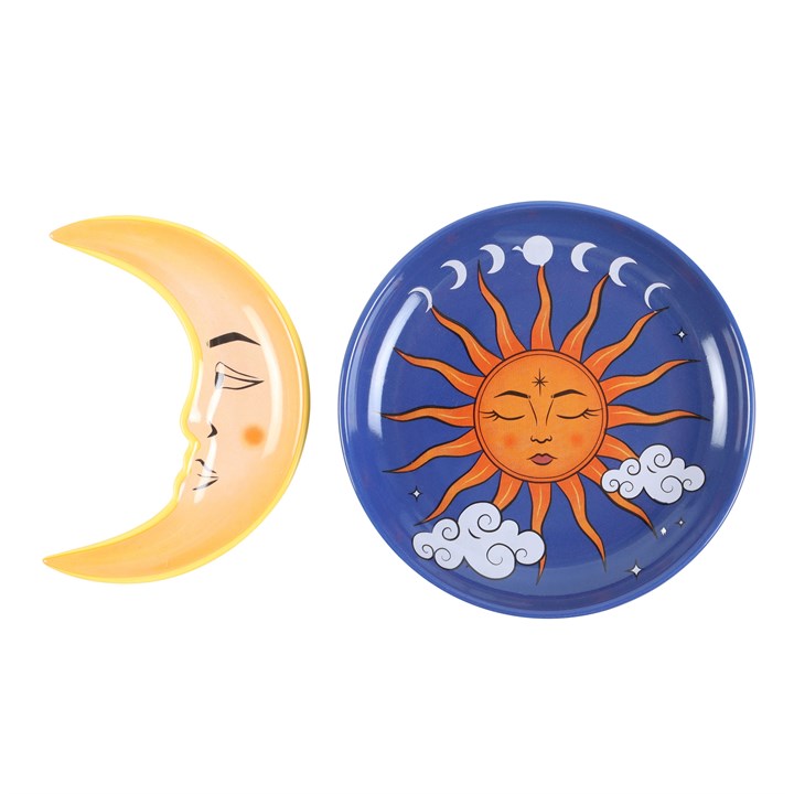 A two-piece ceramic stacking trinket dish featuring the sun as a round dish and the moon as a stackable crescent to the side, which can be placed on top/inside.