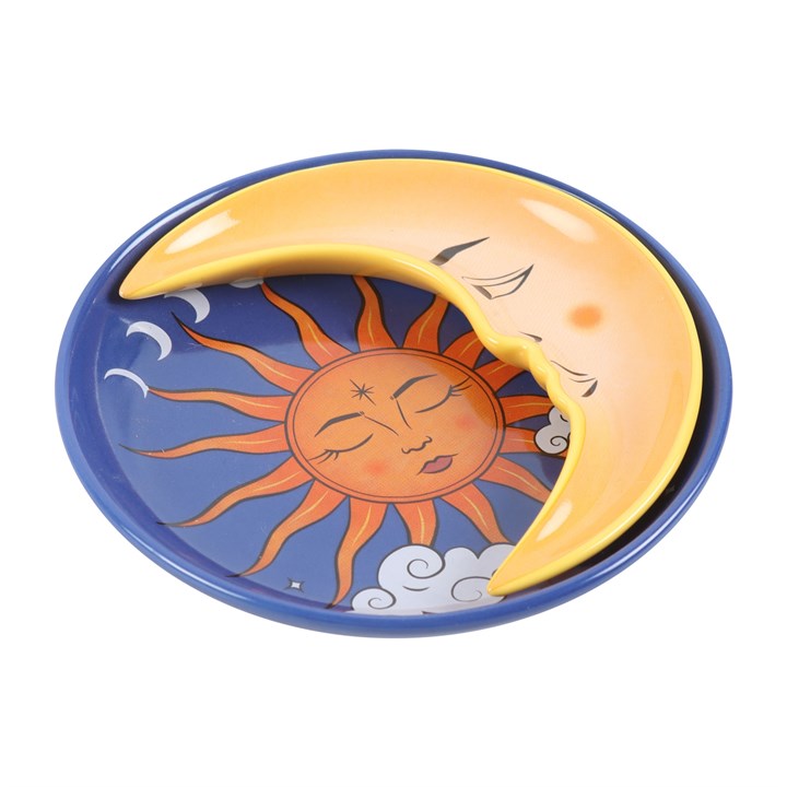 A two-piece ceramic stacking trinket dish featuring the sun as a round dish and the moon as a stackable crescent on top