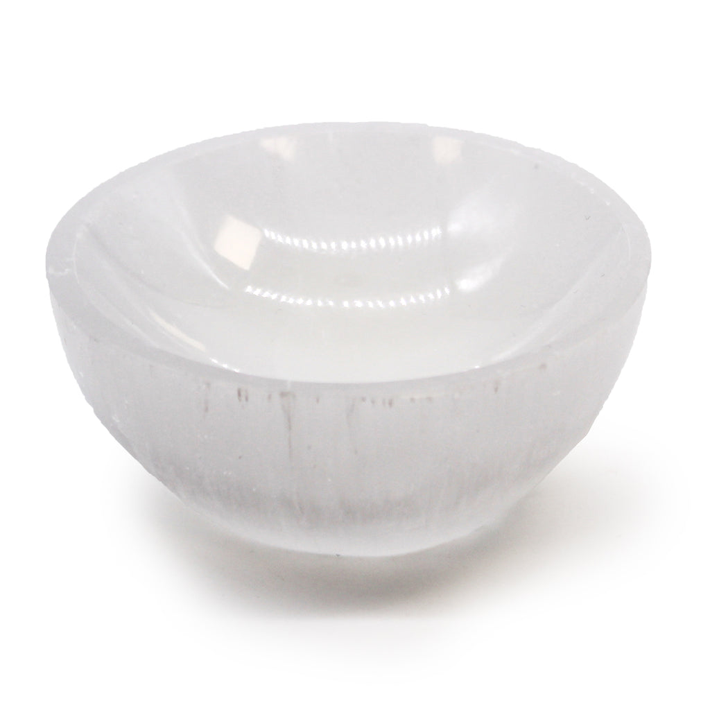 A white selenite bowl on a white background