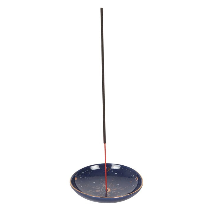A round blue incense holder and incense stick