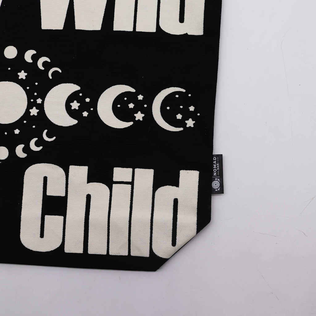 Black bag with white text and moon phases design on a white background