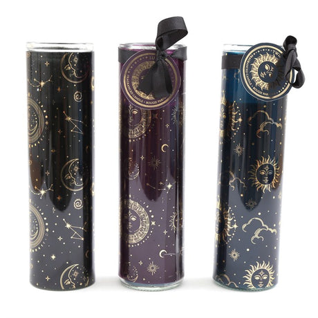 Three tube candles with gold foil accents and black ribbons. Each tube is decorated with a different celestial motif: a sun, moon, and stars configuration.