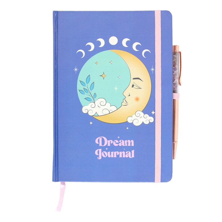A blue hardcover journal with celestial themed artwork, titled 'Dream Journal', accompanied by an amethyst pen