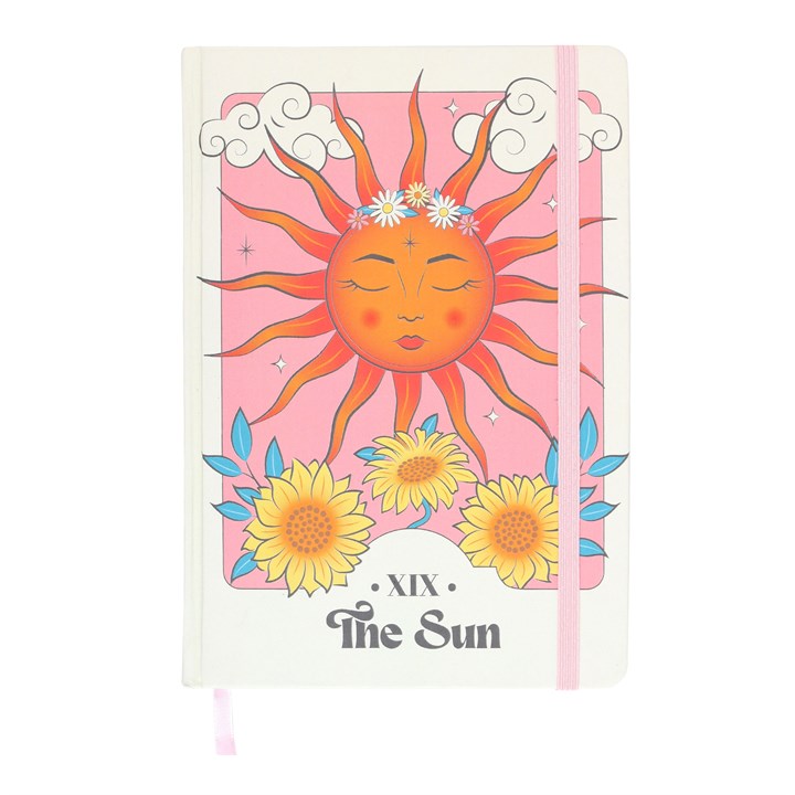 A5 notebook with a celestial design featuring a sun and flowers on the cover