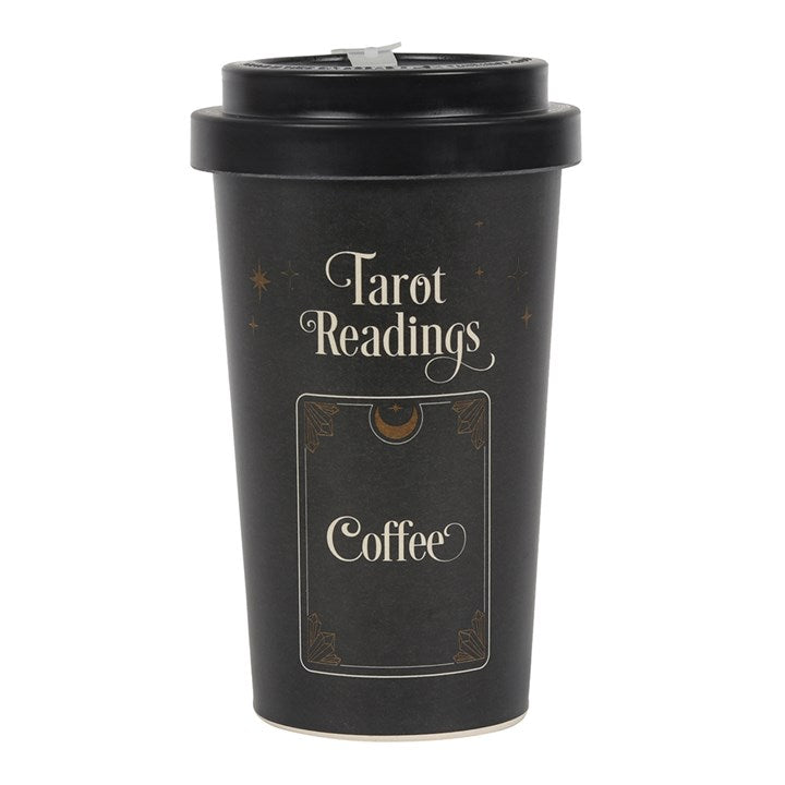 A black bamboo eco travel mug with a 'Tarot Readings' text and a coffee cup design, accompanied by a silicone sleeve and lid, placed against a white background