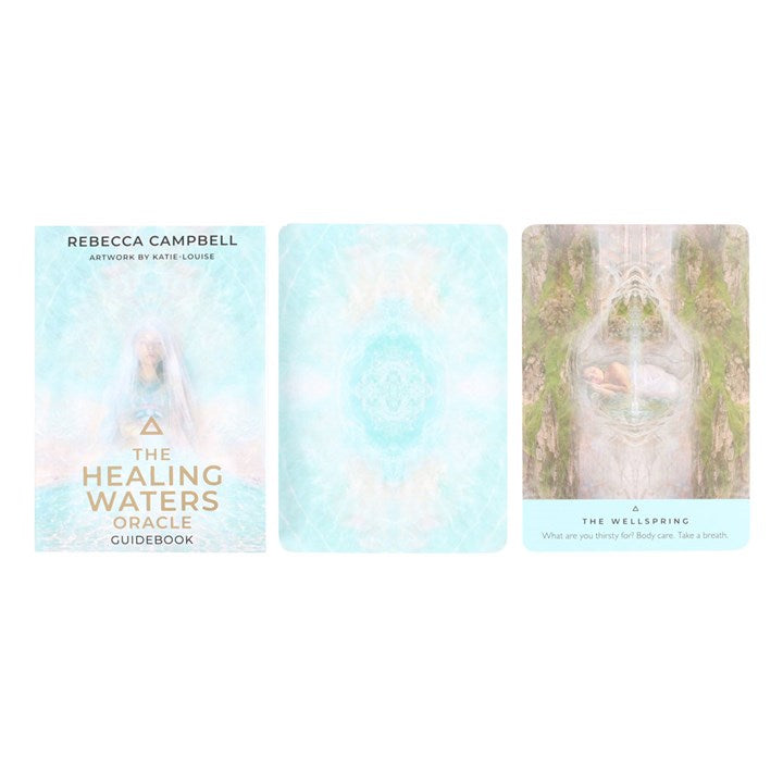 The pale blue guidebook for 'The Healing Waters Oracle Cards' by Rebecca Campbell and Katie-Louise, next to a pale blue oracle card and another "The Wellspring" oracle card.