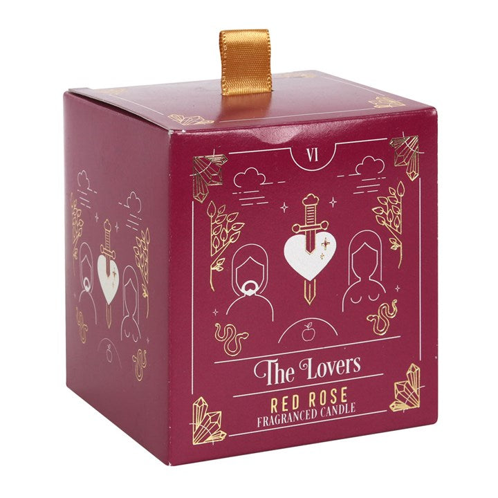 A red square candle box with a tarot card design on the label