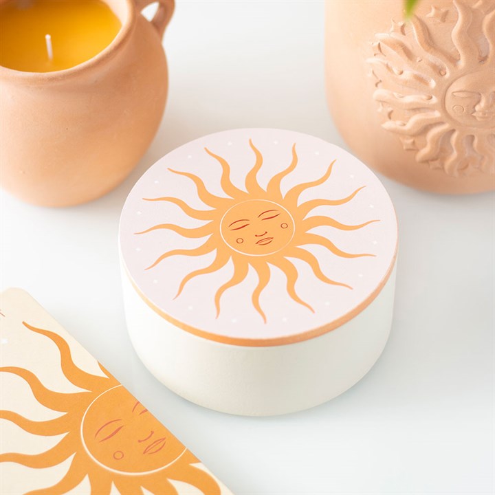 Jewellery box with sun design on a white surface