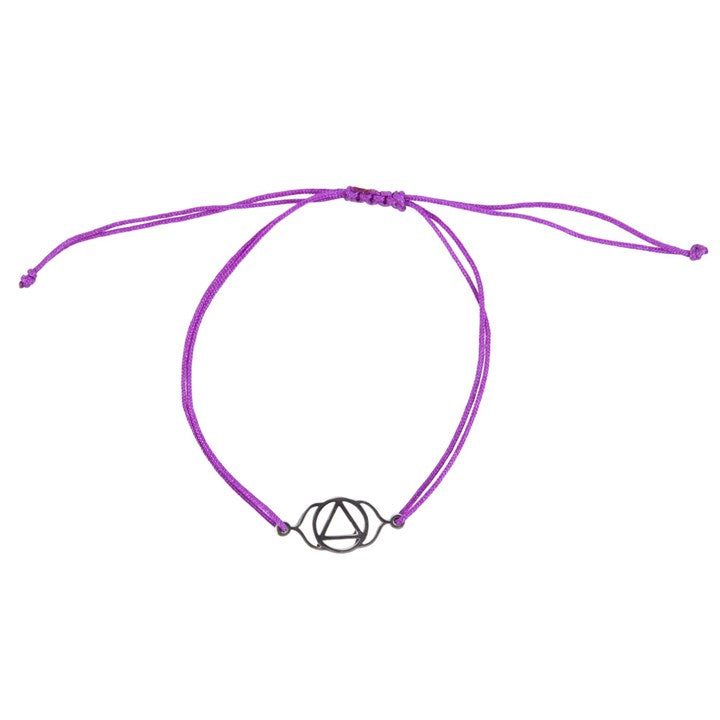 A Third Eye Chakra charm bracelet with a purpley band and a silver charm, against a white background 