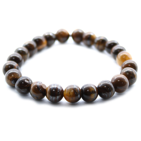 A beaded bracelet made with round brown and gold Tiger's Eye stones.