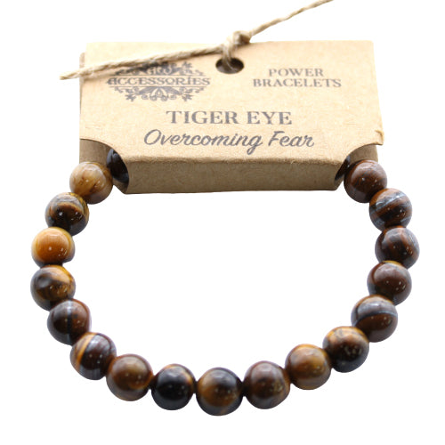 A beaded bracelet made with round brown and gold Tiger's Eye stones.
