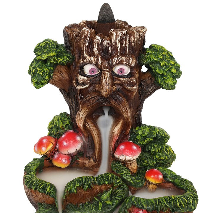 A colourful backflow incense burner featuring the Tree Man design with toadstools around it. The burner is made of resin.