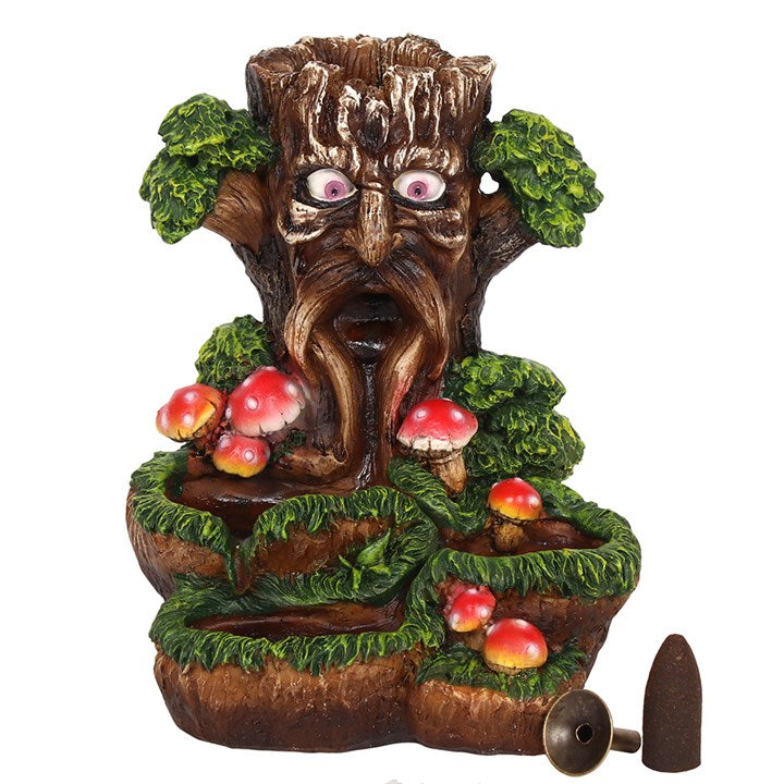 A colourful backflow incense burner featuring the Tree Man design with toadstools around it. The burner is made of resin.