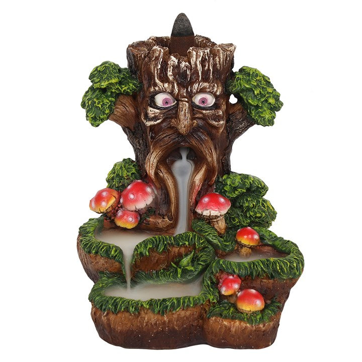 A colourful backflow incense burner featuring the Tree Man design with toadstools around it. The burner is made of resin.