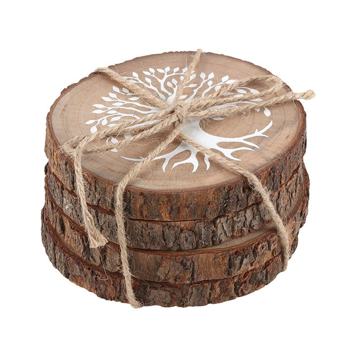 Four piled wooden coasters with a white tree of life motif, tied together with string