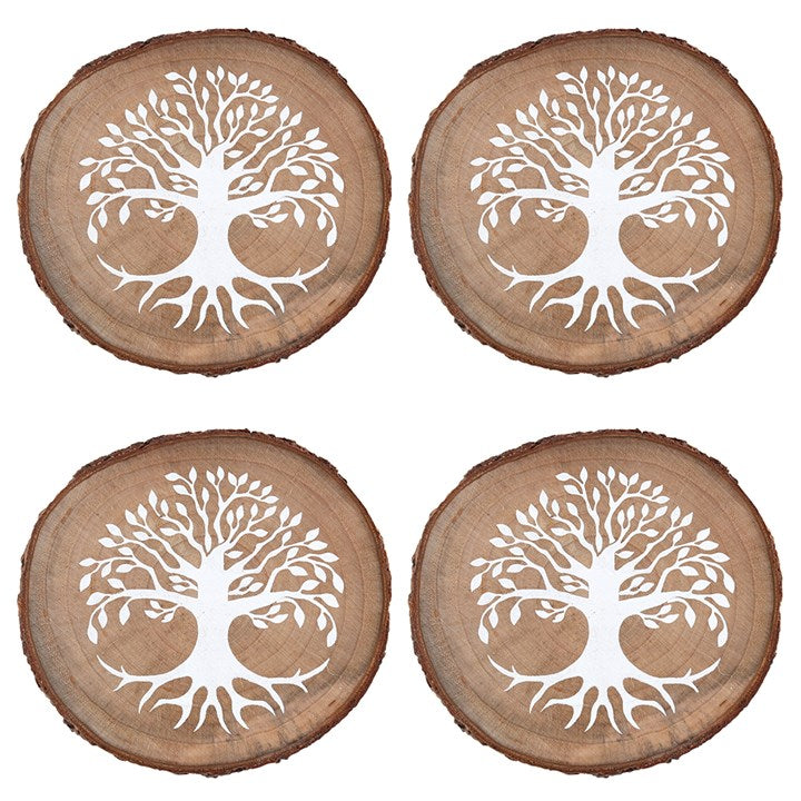Four separate wooden coasters with a white tree of life motif