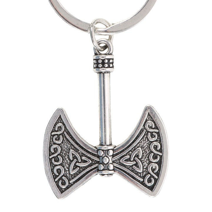 Silver axe-shaped keychain with intricate designs on a white background