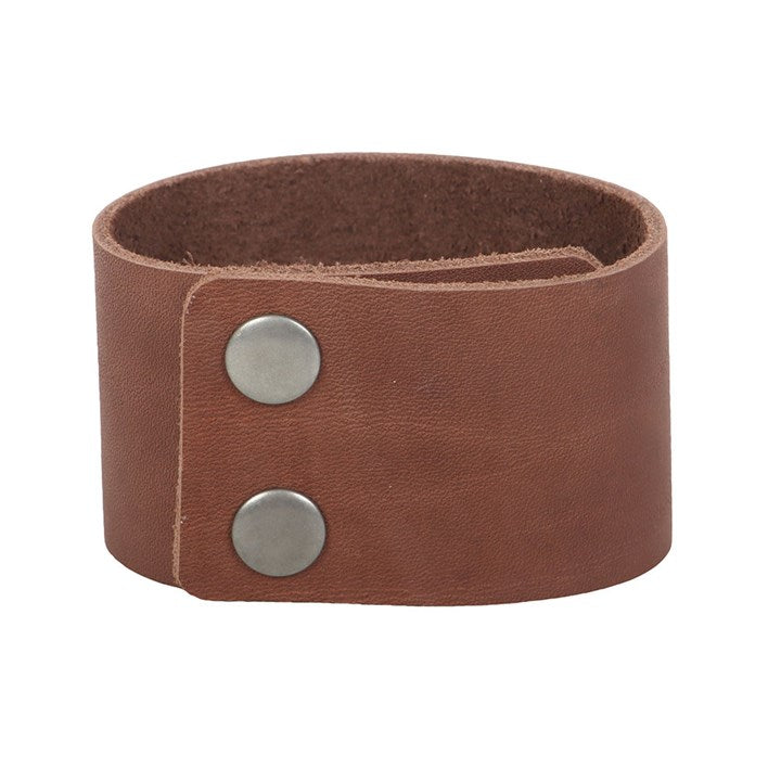 Brown leather bracelet with two silver poppers on a white background
