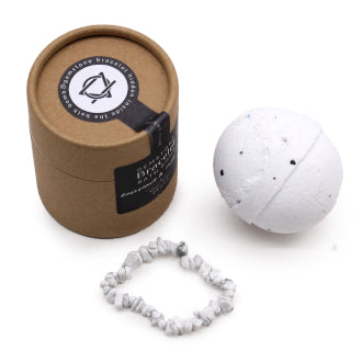 A bath bomb with a white jasper gemstone bracelet and grapefruit-scented, packaged in a brown kraft paper box and a white bracelet visible outside the box.