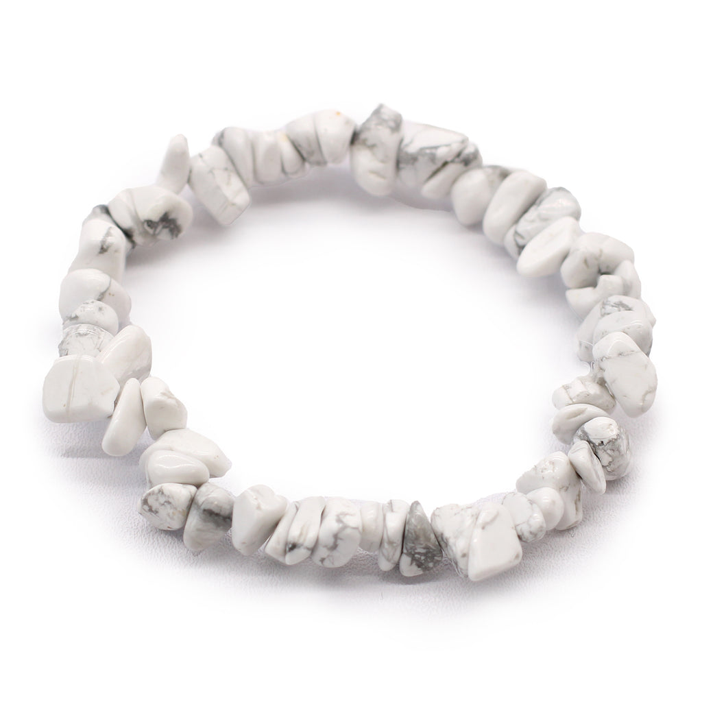A close up of a white jasper chip crystal bracelet on a whitebackground