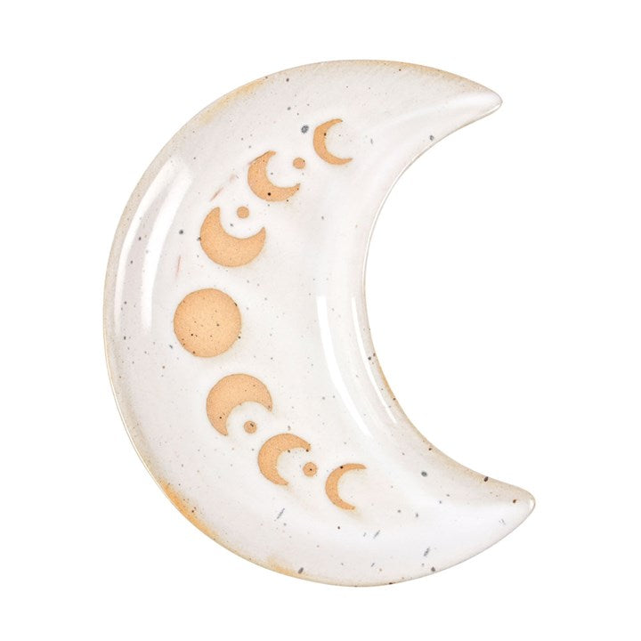A white, speckled crescent moon trinket dish with golden moon phase detailing on a white background.