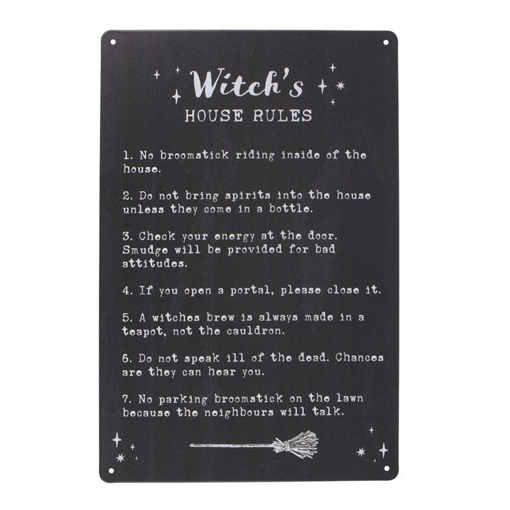 A metal sign with 7 Witch's House Rules listed