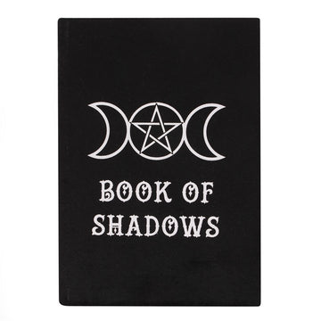 Black A5 notebook with a white mystical triple moon design and the title 'BOOK OF SHADOWS' written on the cover.