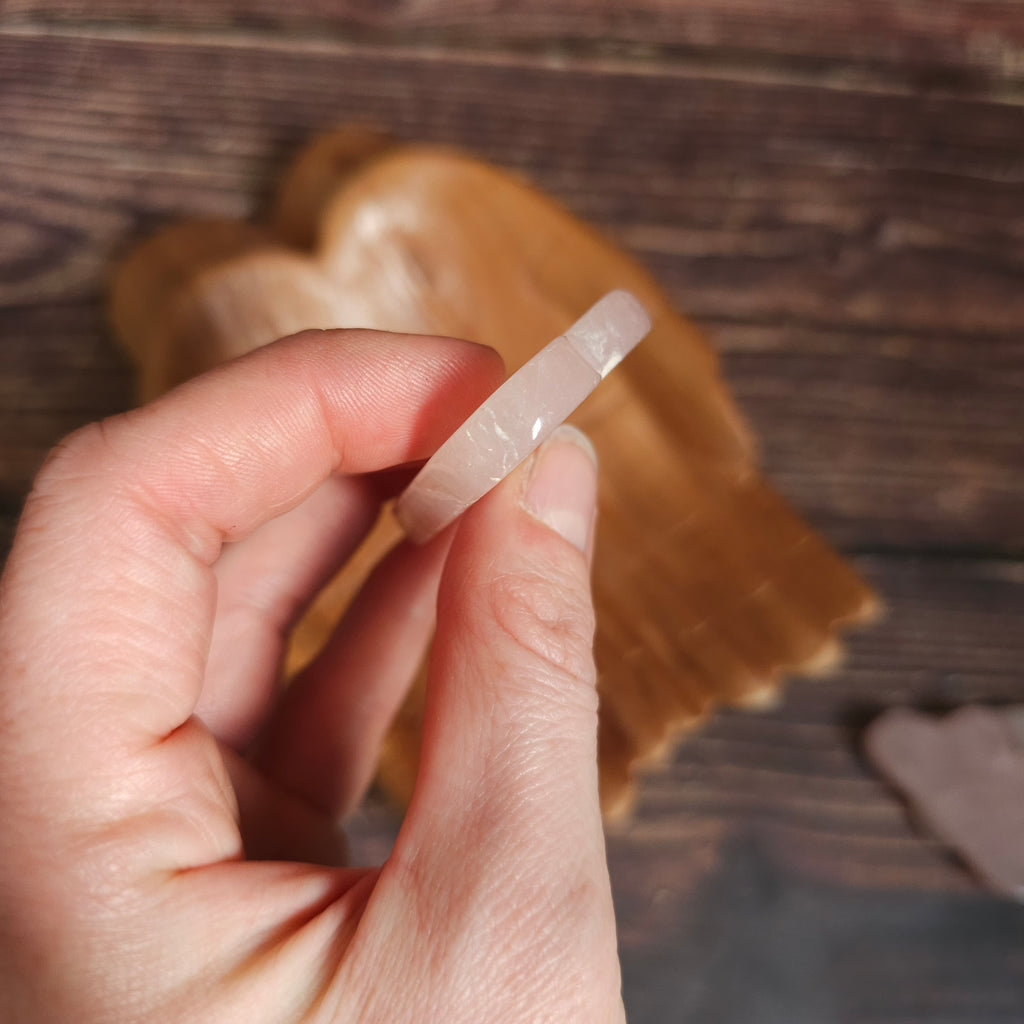 Crystal cloud shown from the side, held in a hand