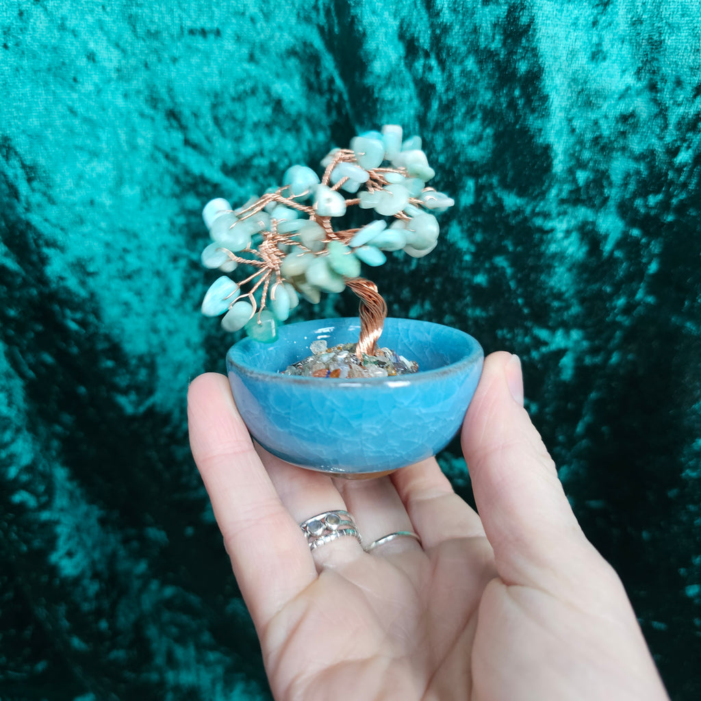 An Amazonite crystal tree in a ceramic tea bowl.